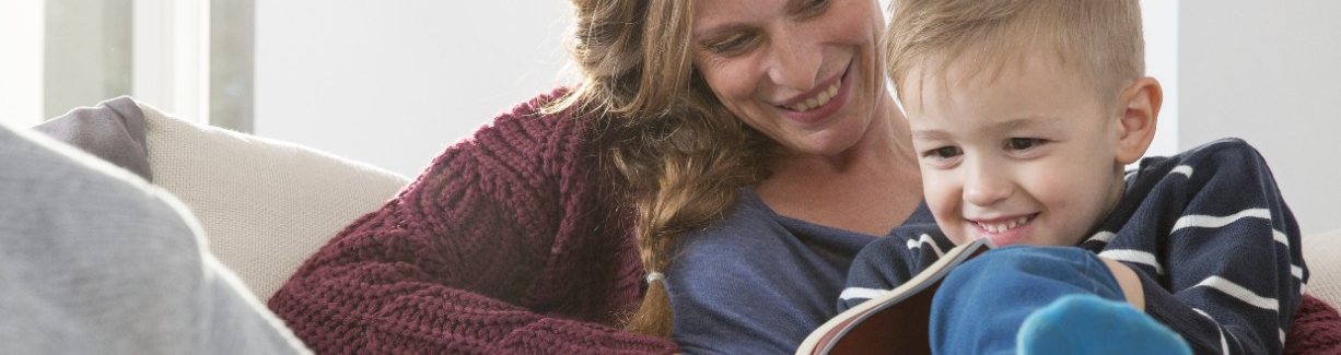 Mother and child reading a book