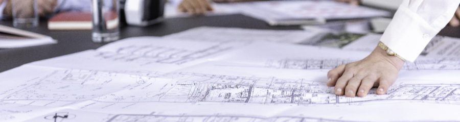 Blueprints at conference table