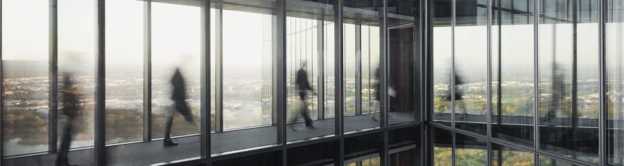 People walking on connecting bridges at Vienna Twin Towers