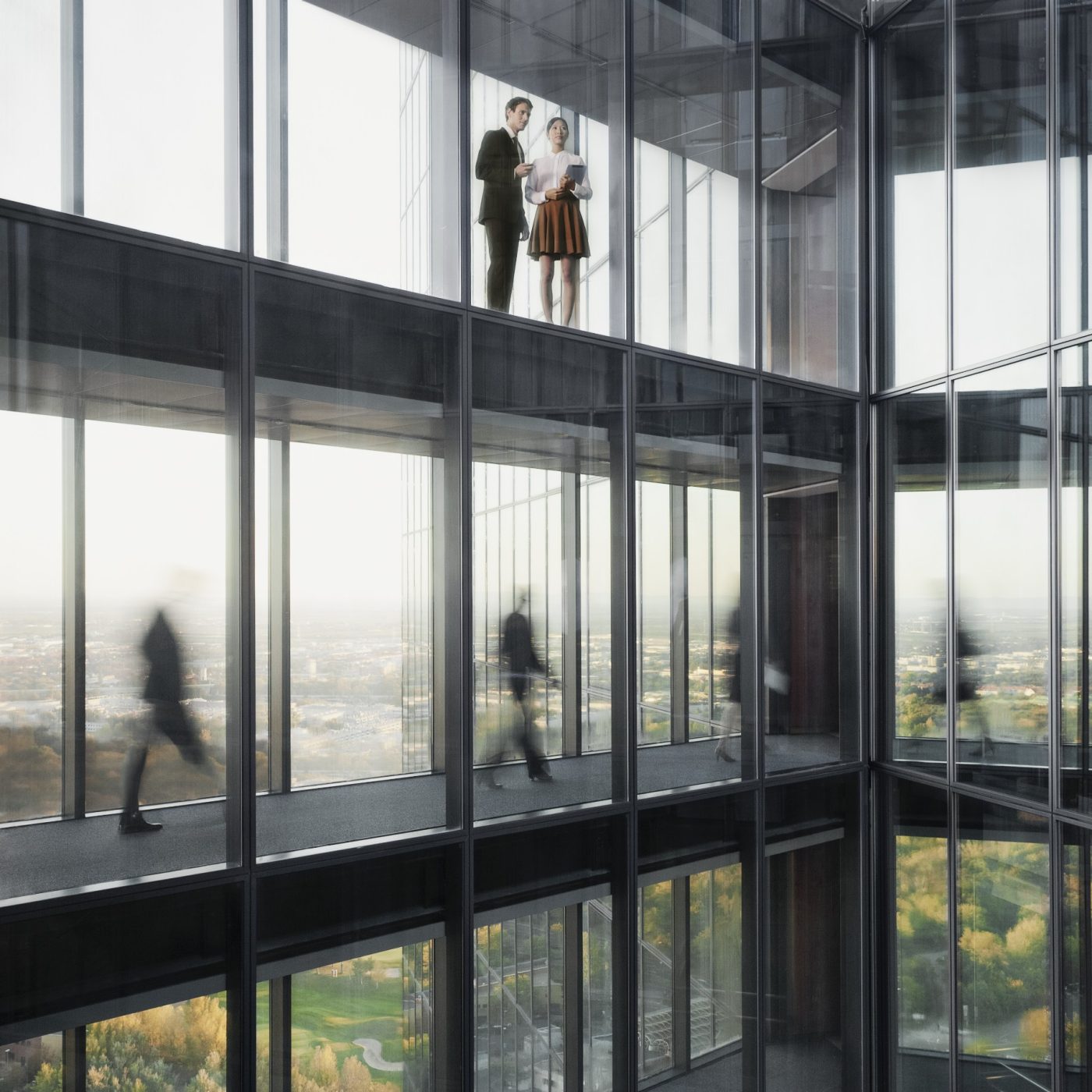 People walking on connecting bridges at Vienna Twin Towers