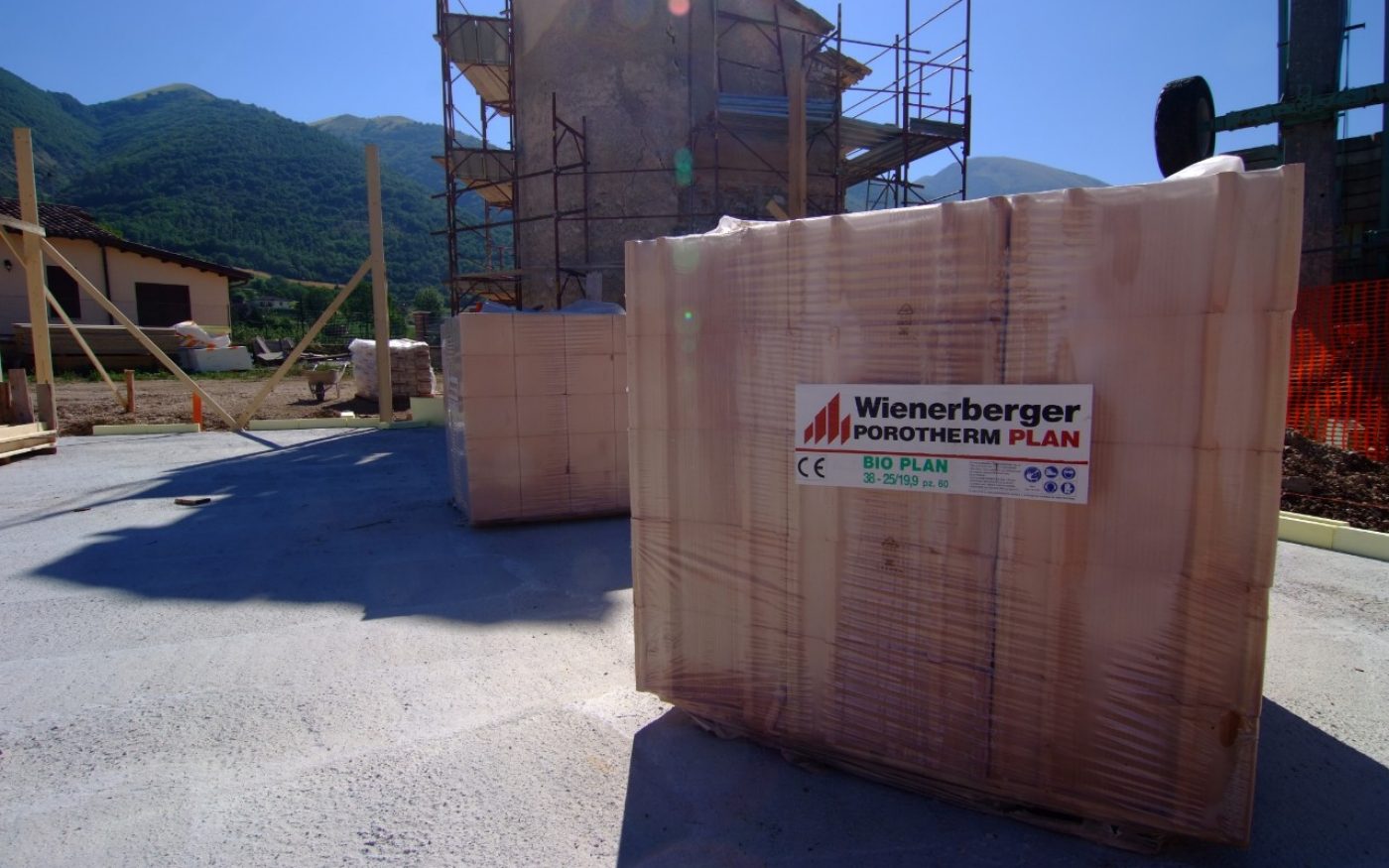 Building site with pallet of bricks of open house (4 faced) from Norcia