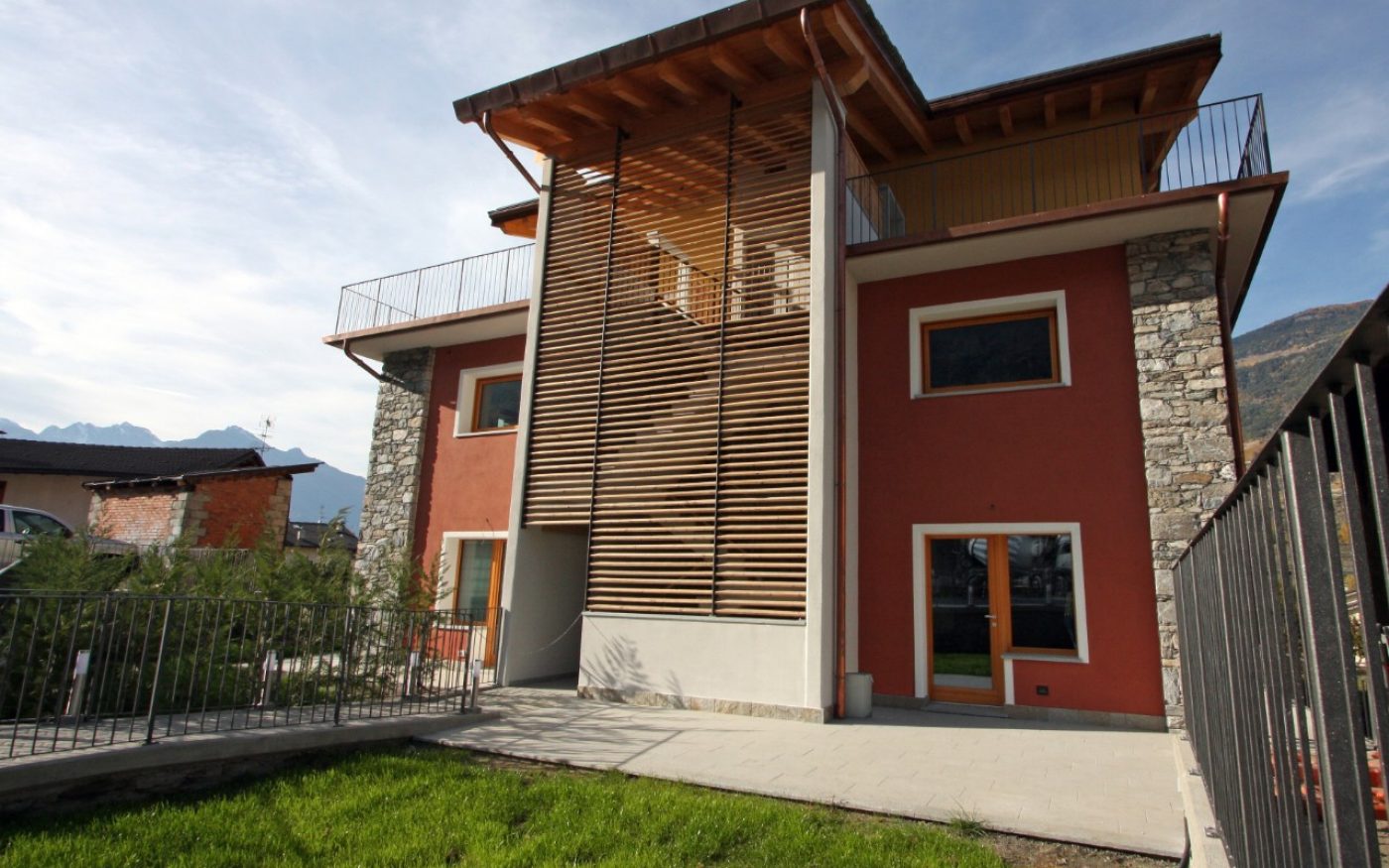 Behind overview multy family house Aosta with garden renovation with Porotherm