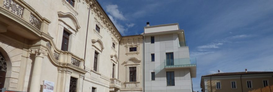 Overview of historic boulding near a innovative building renovated with Porotherm BIO PLAN 38 T-0,09