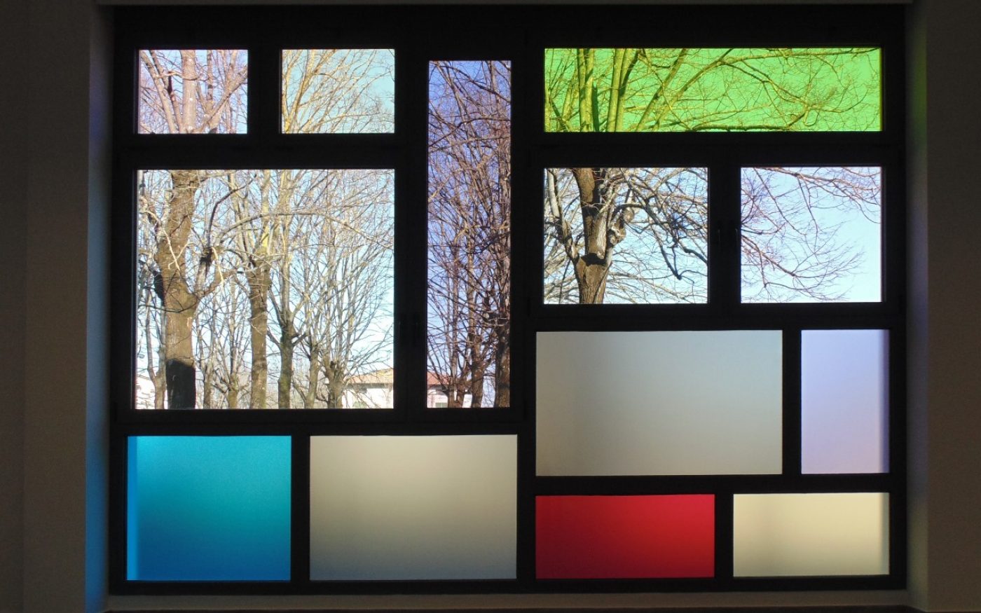 Windows of Castel Bolognese school with garden outside
