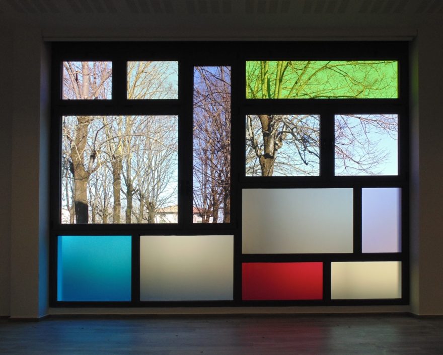 Windows of Castel Bolognese school with garden outside