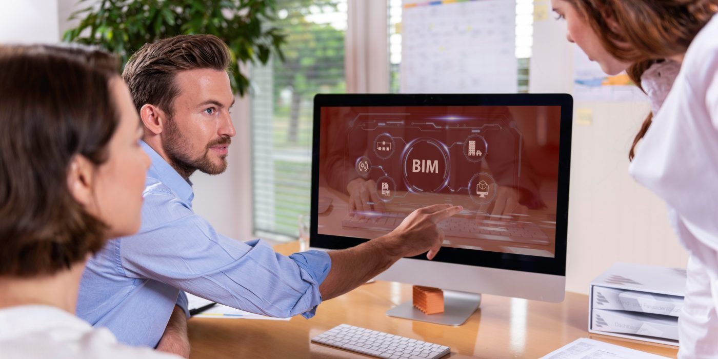 Project managers at office desk working with BIM